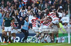 Japan's players celebrate what may, perhaps, become the most famous try in rugby history.